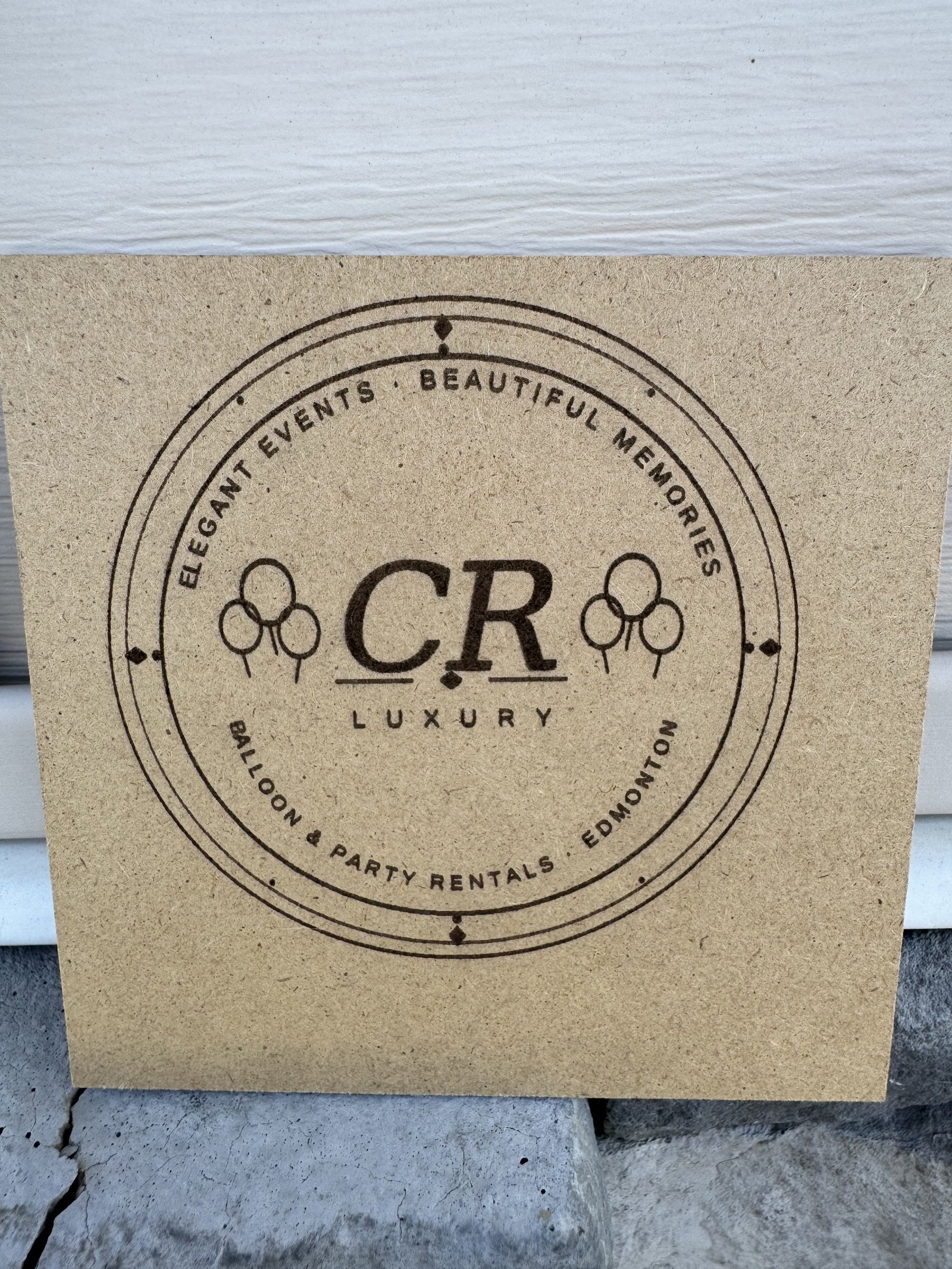 CR Luxury logo laser engraved on wood